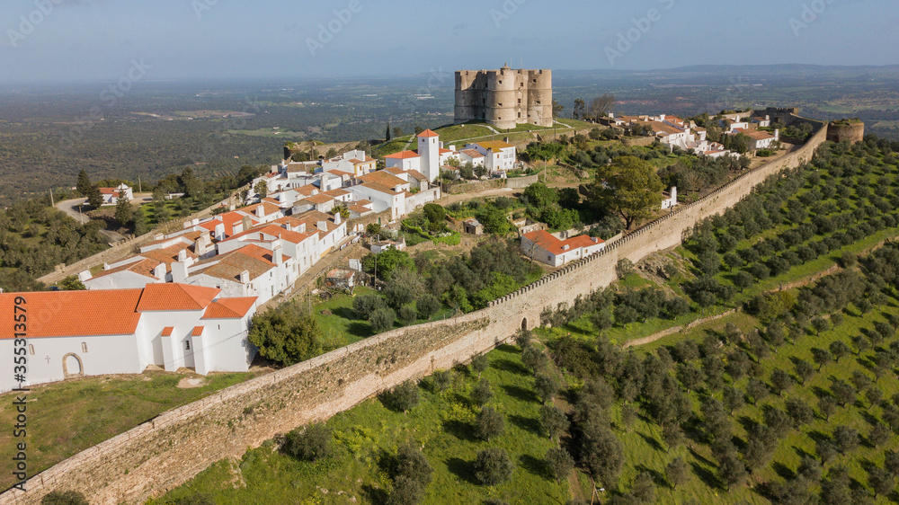 Medieval city of Evoramonte - Portugal. Aerial view of the fortified city with olive plantations around in the Alentejo region in Portugal