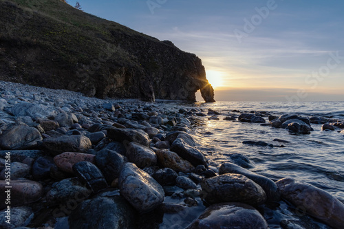 Morning landscape overlooking a stone arch on the shore of Lake Baikal