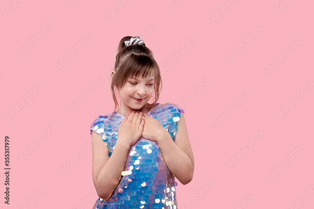 Cute brunette girl in a shiny blue dress. Cute brunette girl in a shiny blue dress.
