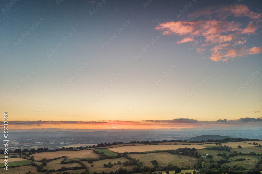 aerial view of english countryside in the cotswolds at dusk
