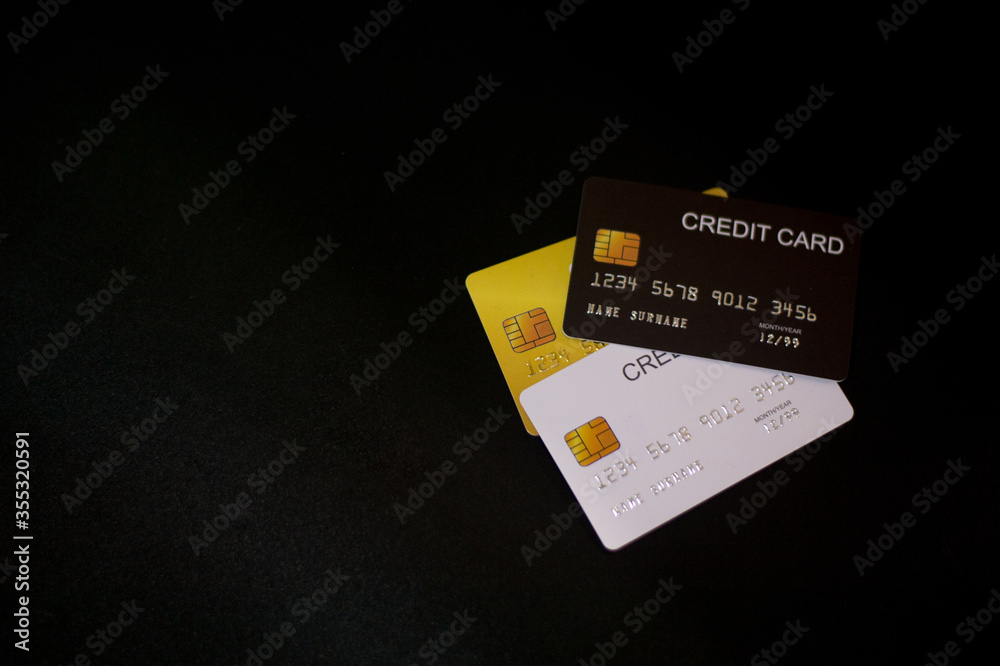 Focus and Close-up many credit cards, black screen background, Payment concept, Shopping Concept, Online Shopping, The buying and use of goods and services. Focus and Close-up many credit cards, black screen background, Payment concept, Shopping Concept, Online Shopping, The buying and use of goods and services.