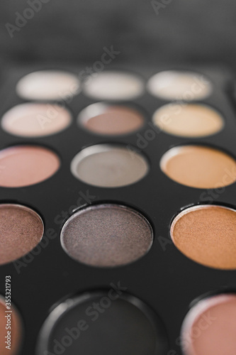 cosmetics and beauty, close-up of eyeshadow palette with neutral nude tones and shallow depth of field