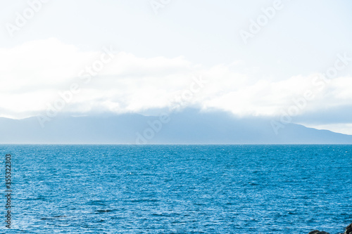 Calm mediterranean sea Ocean And Blue Sky Background waves soft surface, abstract background pattern  © ric