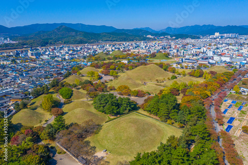 Panorama of Tumuli park and other royal tombs in the center of Korean town Gyeongju photo