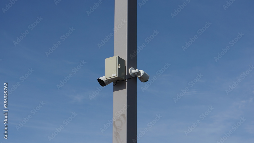 security camera on blue sky