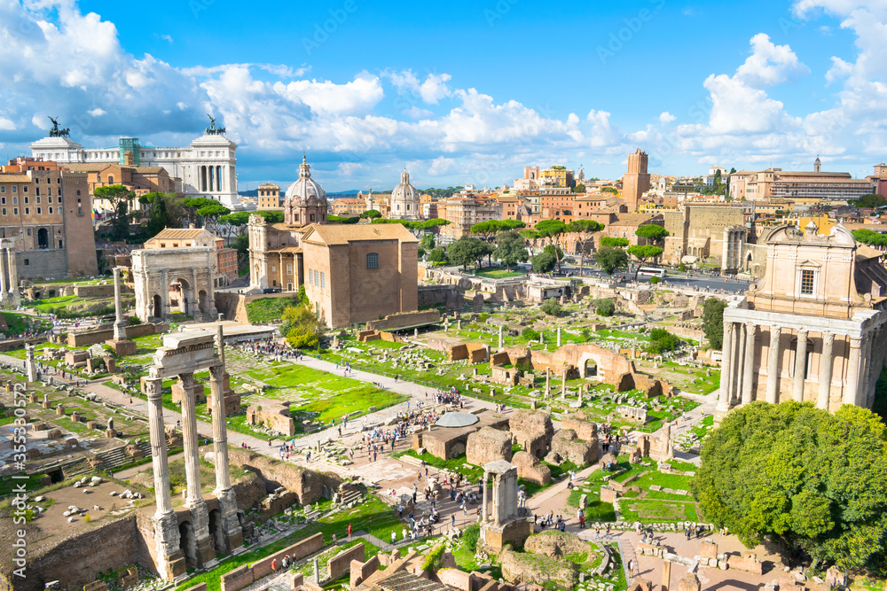 Beautiful view of Roman Forum ruins (Forum Romano) with Victor Emmanuel II Monument in the background - Rome, Italy