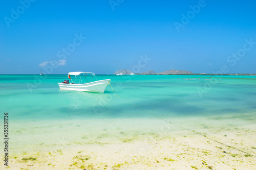 Enjoying a beautiful day on the paradise beach in Madrisqui Island - Caribbean - Archipelago of los Roques - Venezuela photo