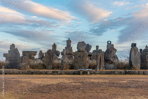 Dongjasok - stone guardians at Jeju stone park, republic of Korea photo