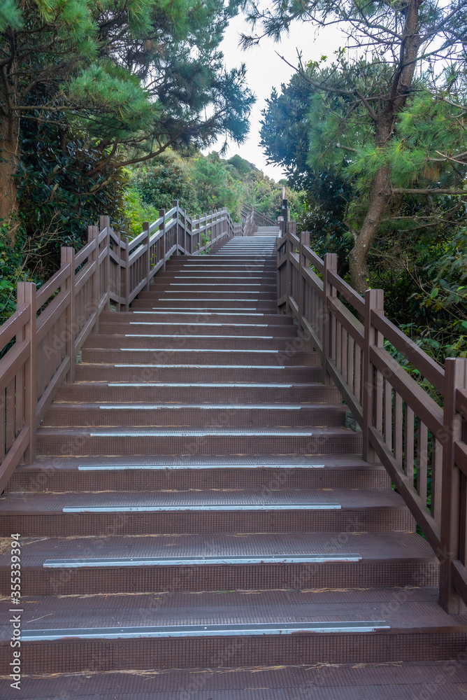 Fototapeta Staircase leading to the top of Seongsan Ilchulbong known as sunrise peak at Jeju Island, Republic of Korea