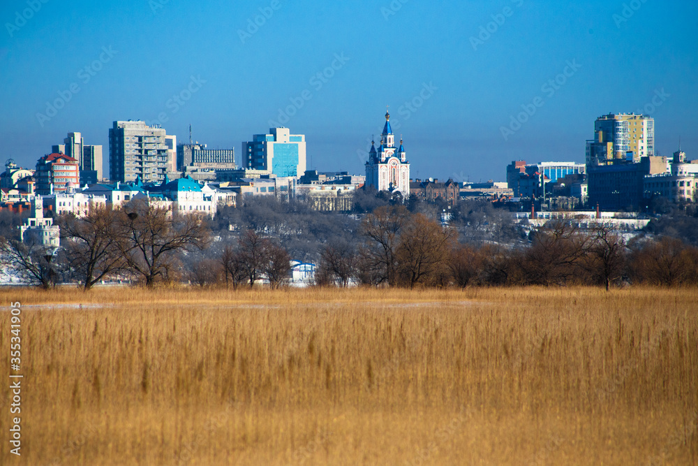 view of the temples of Khabarovsk, across the Amur river