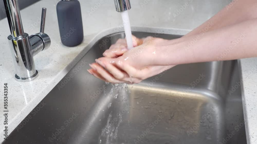 A girl rinses her hands under the faucet in the kitchen. Removing germs through handwashing helps prevent diarrhea and respiratory infections and may even help prevent skin and eye infections A girl rinses her hands under the faucet in the kitchen. Removing germs through handwashing helps prevent diarrhea and respiratory infections and may even help prevent skin and eye infections
