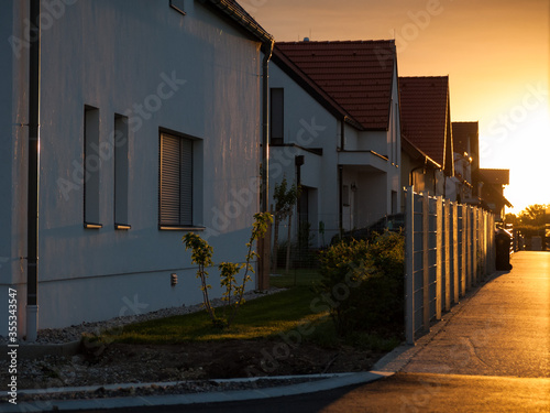 Sunrise at suburban street in a small village