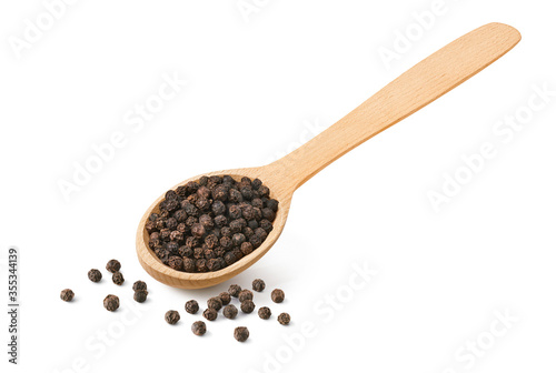Black pepper grains in wooden spoon isolated on white background.