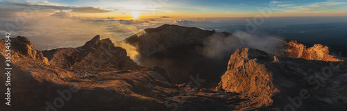 sunrise at the top of agung volcano. crater view. Higher than clouds. rinjani view. High quality panorama photo. Bali - island of gods. Indonesian mountains. trekking rote to summit. eruption