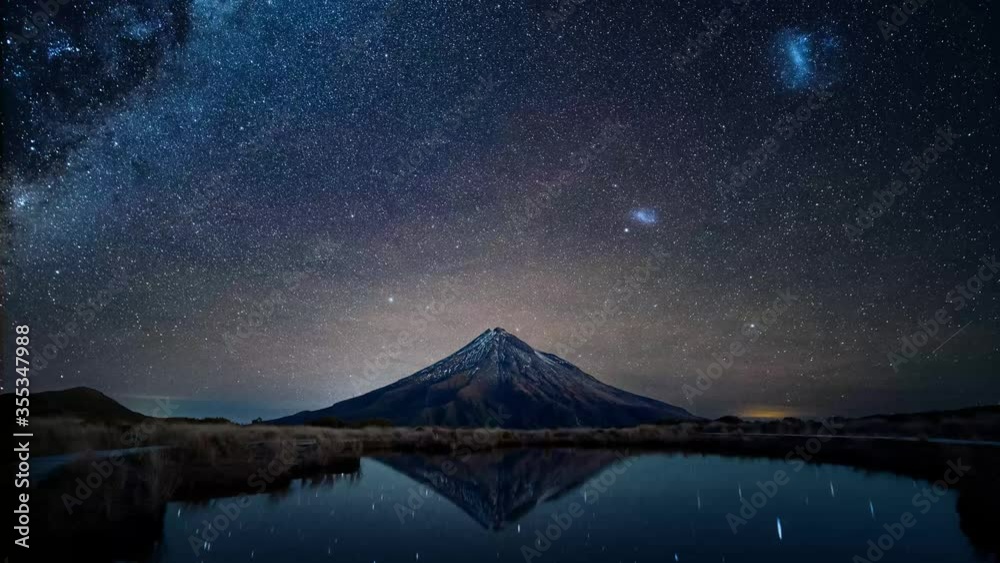 Night sky over Mt. Taranaki reflecting in Pouakai Pool, New Zealand, Timelapse Night sky over Mt. Taranaki reflecting in Pouakai Pool, New Zealand, Timelapse