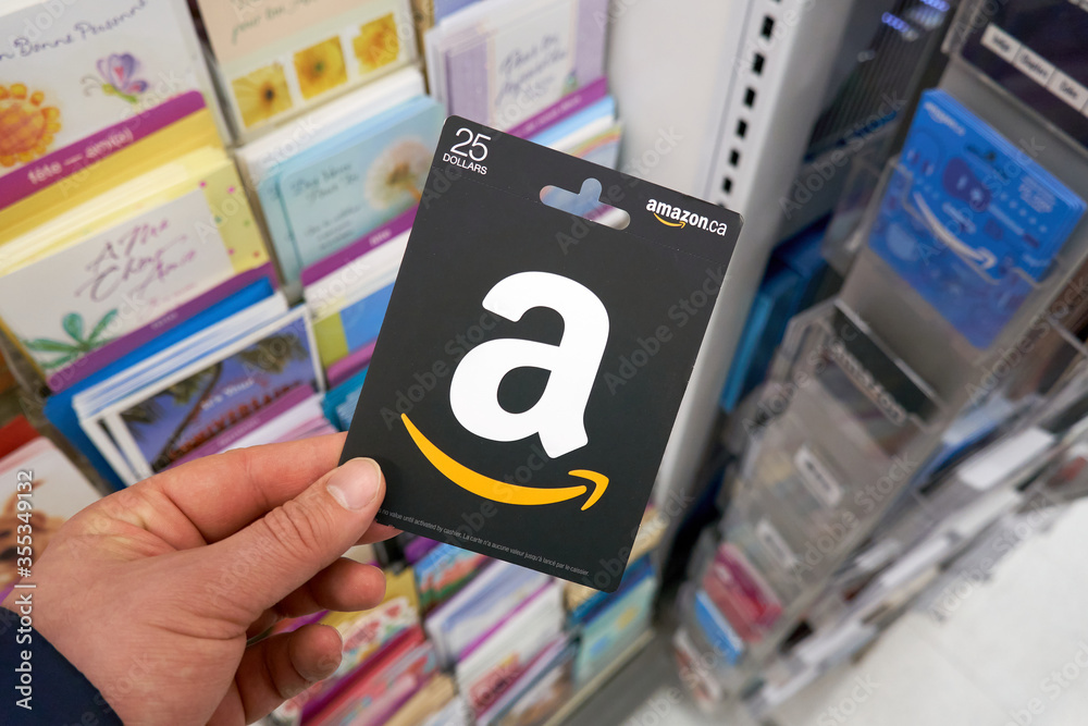 Amazon gift card which never expires in a hand over a stand with gift  cards. Stock-Foto | Adobe Stock