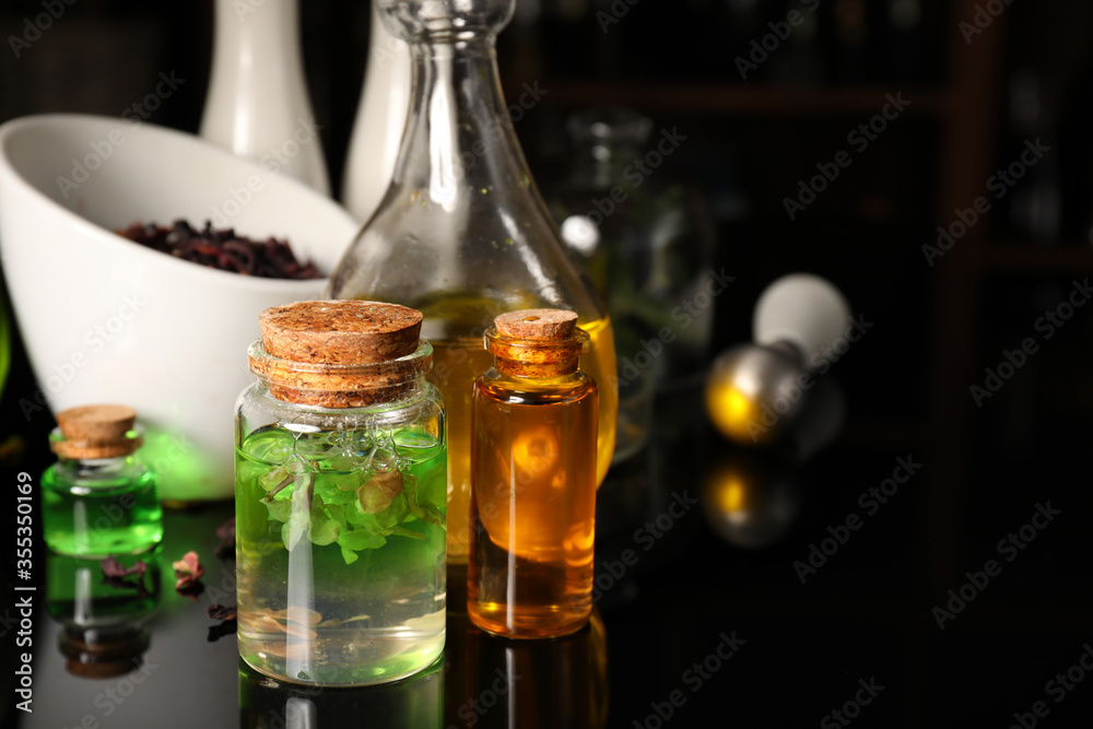 Different potions on alchemist's table Different potions on alchemist's table