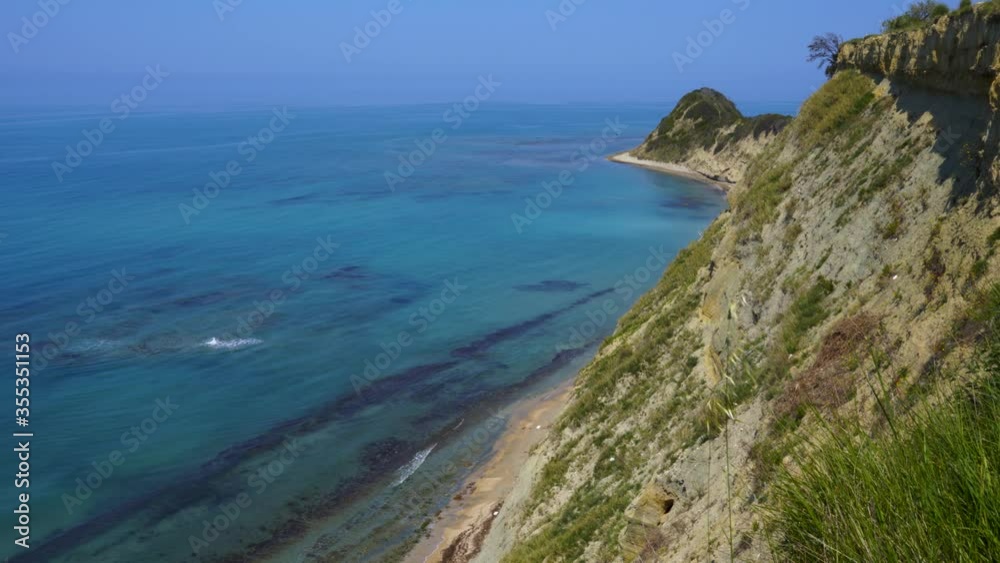 Hills of cape with sharp slopes surrounded by blue turquoise sea water on Mediterranean seaside Hills of cape with sharp slopes surrounded by blue turquoise sea water on Mediterranean seaside