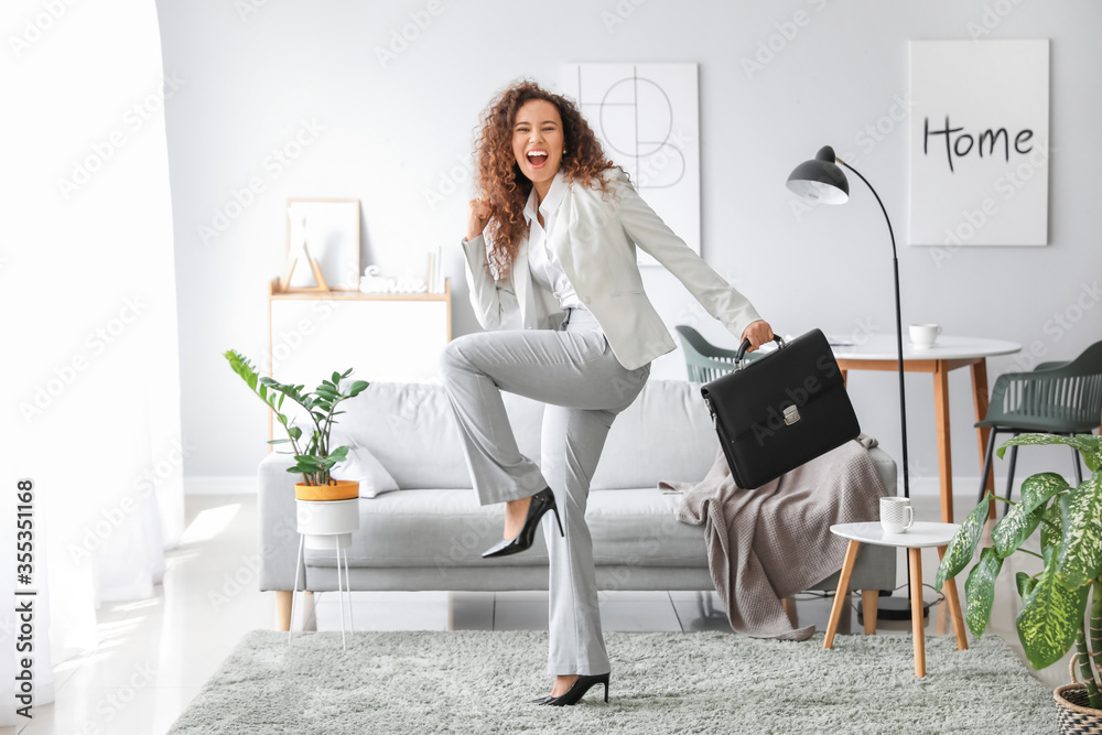 Happy businesswoman before weekends at home - obrazy, fototapety, plakaty 