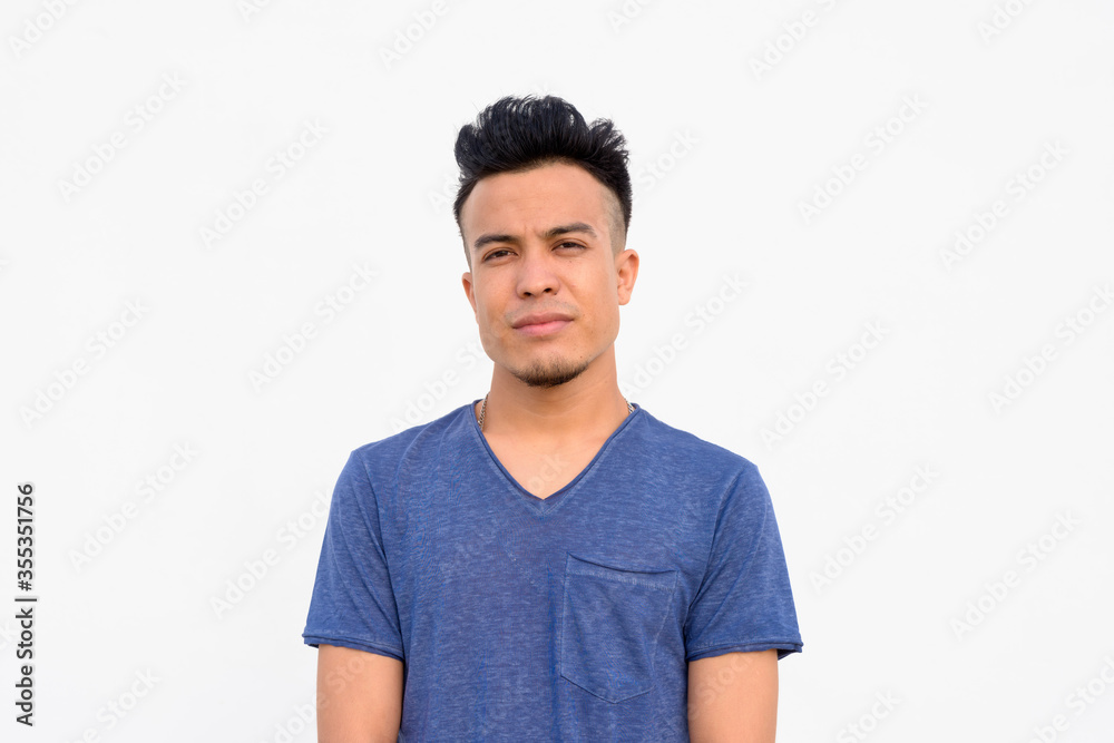 Face of young handsome multi ethnic man against white background Face of young handsome multi ethnic man against white background