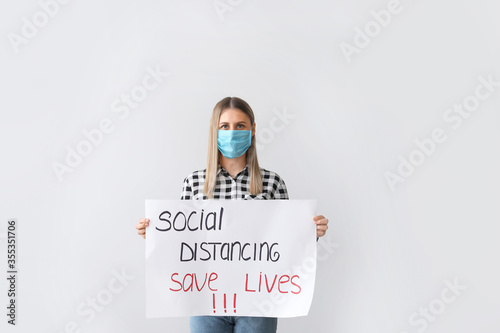 Young woman holding paper w...