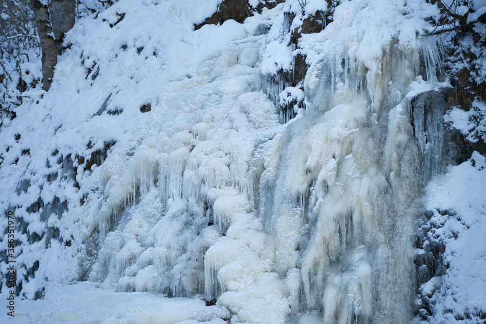 Icy waterfall on a mountain river. Icy waterfall on a mountain river.