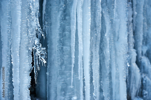 Icicles on the rock. Frozen waterfall in winter. © PhotoBetulo