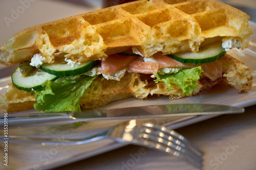 Brussels waffles with smoked salmon and salad.