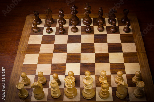 Chess board with chess wooden pieces
