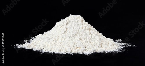 A pile of flour isolated on black background. Full depth of field.