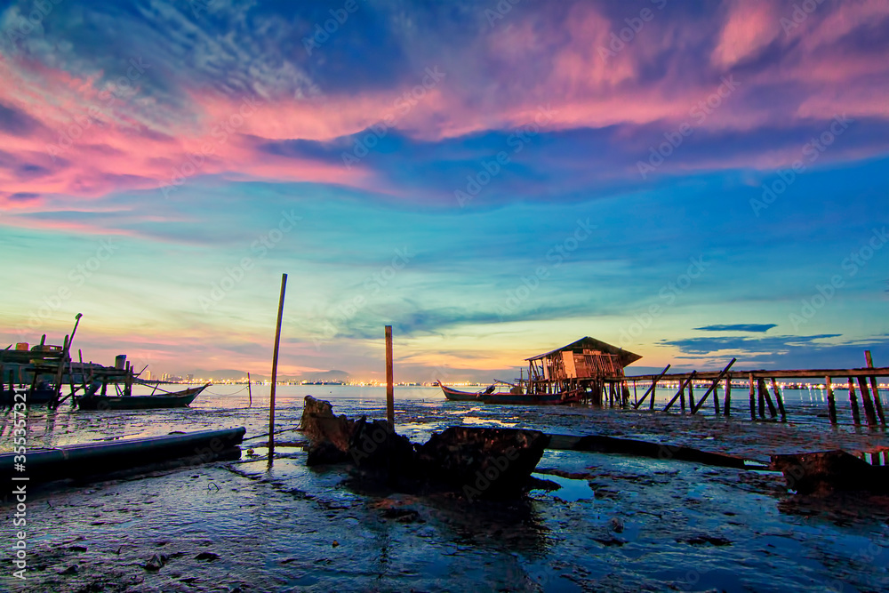 Great landscape view with unique cloud formation during sunrise from Dove Jetty, Penang during low tide Great landscape view with unique cloud formation during sunrise from Dove Jetty, Penang during low tide