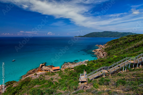 Landscape of Pulau Perhentian Kecil with staircase towards damaged jetty photo