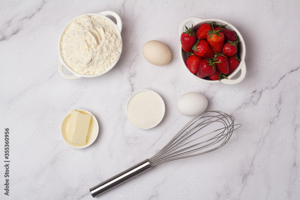 ingredients for baking strawberry muffins. ingredients for baking strawberry muffins.