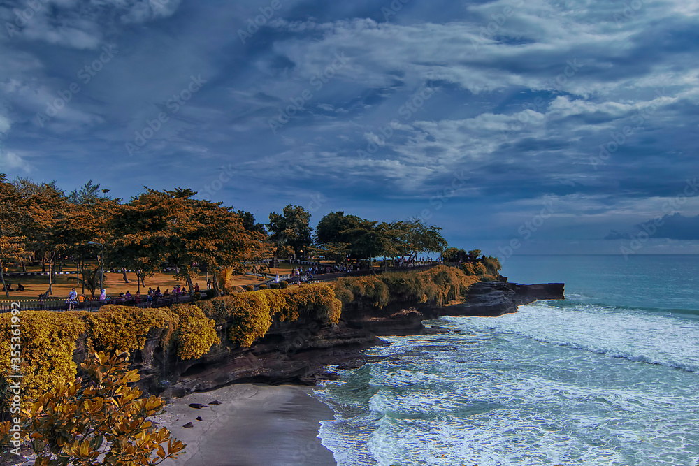 Magnificent nature view of a cliff in Tanah Lot, Bali with additional summer effect