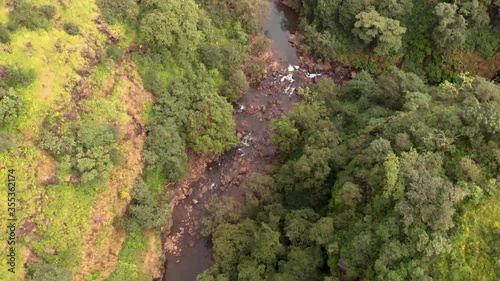 Aerial drone view of forest stream, Maharashtra, India. photo