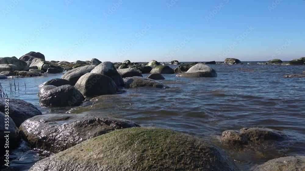 Coastal stones of Cape Kolgompia on a May day. Gulf of Finland, Russia Coastal stones of Cape Kolgompia on a May day. Gulf of Finland, Russia