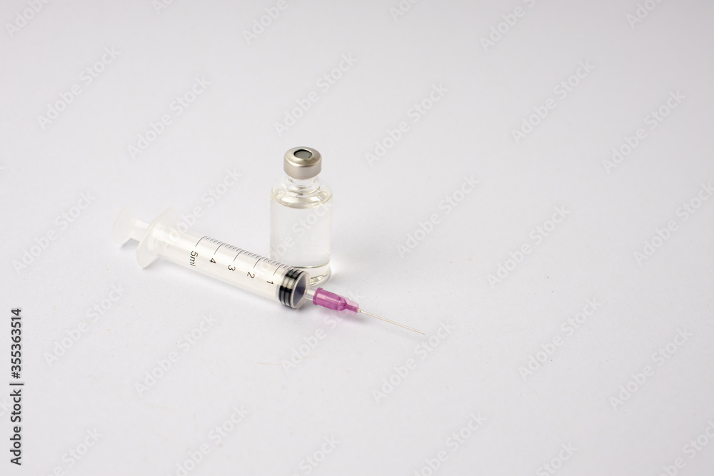 syringe, vaccine, lying on a white background syringe, vaccine, lying on a white background