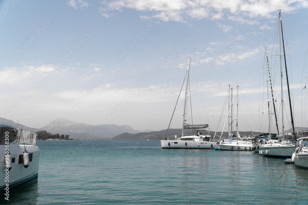 Aegina Island of Greece. Yachts of fishing village. Sky and sea, hills. Mediterranean sea