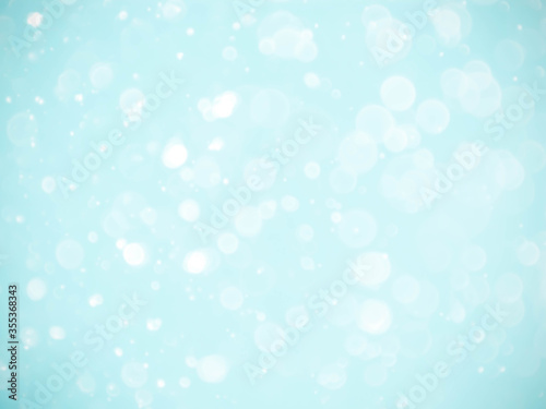 blue background with soft bokeh lights.