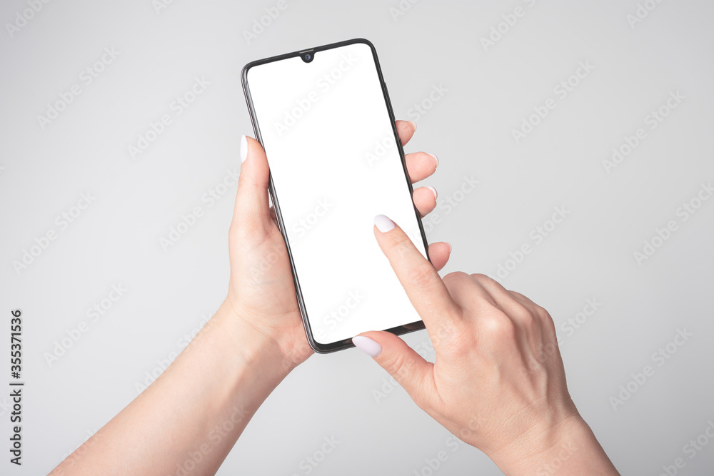 Female Hands Holding Mobile Cell Phone With Blank Screen, mockup phone