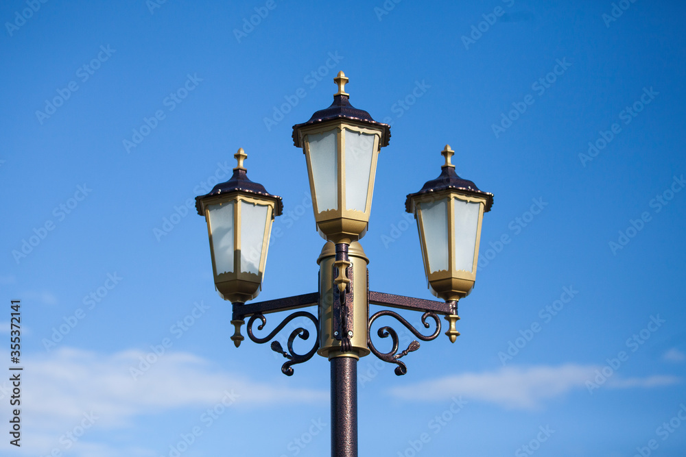 Lamp of street lighting on the city street in the afternoon.