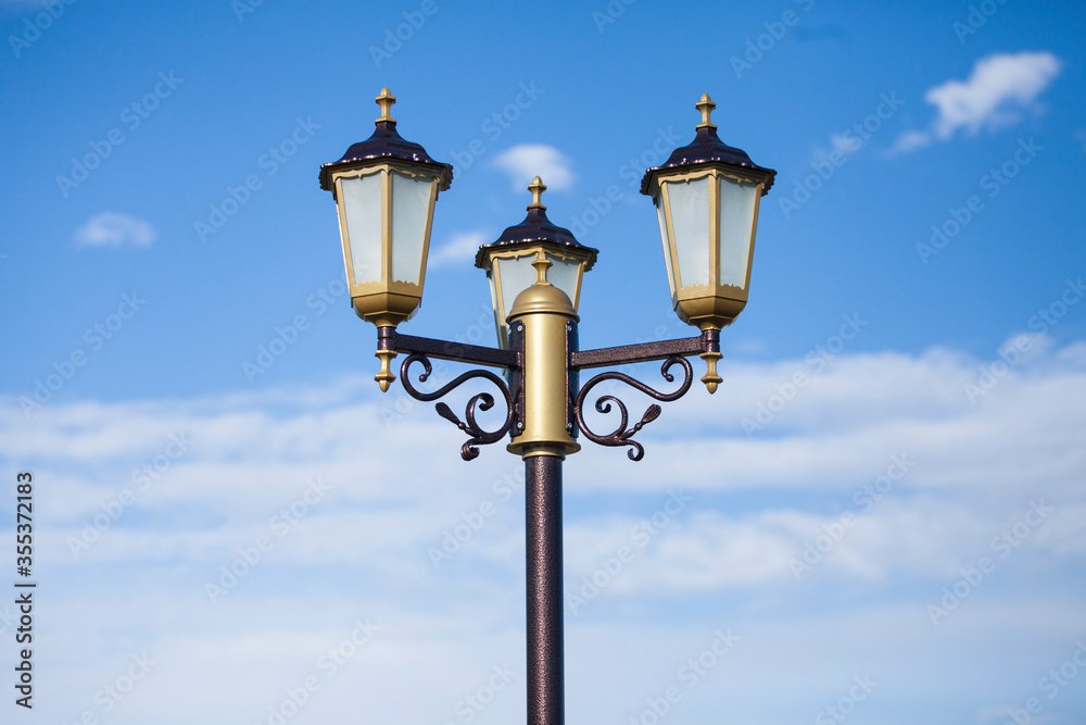 Lamp of street lighting on the city street in the afternoon.