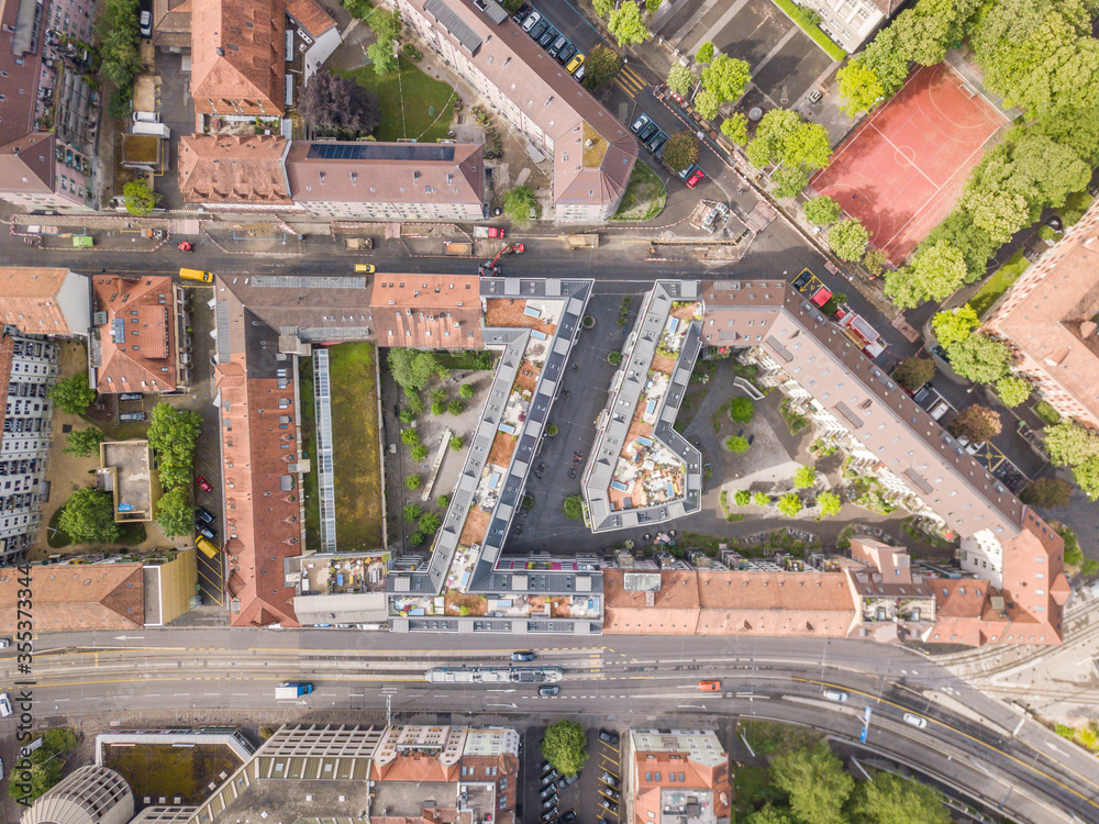 Aerial view of buildings and urban cityscape with streets in overhead view. Beautiful roof of urban housing.Zurich city in  Switzerland in Europe from above.