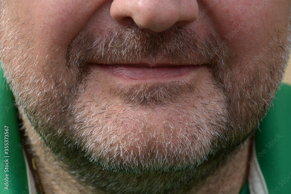 face to face shot of three-day full beard of middle aged man with narrow lips face to face shot of three-day full beard of middle aged man with narrow lips