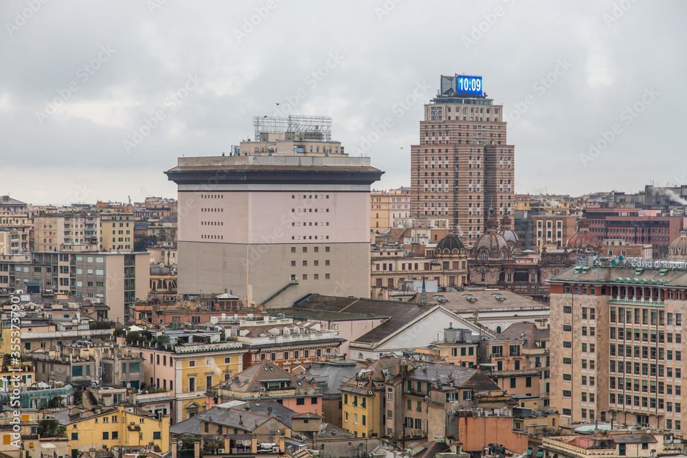 View from above of the old historical center quarter and modern districts of european city Genoa