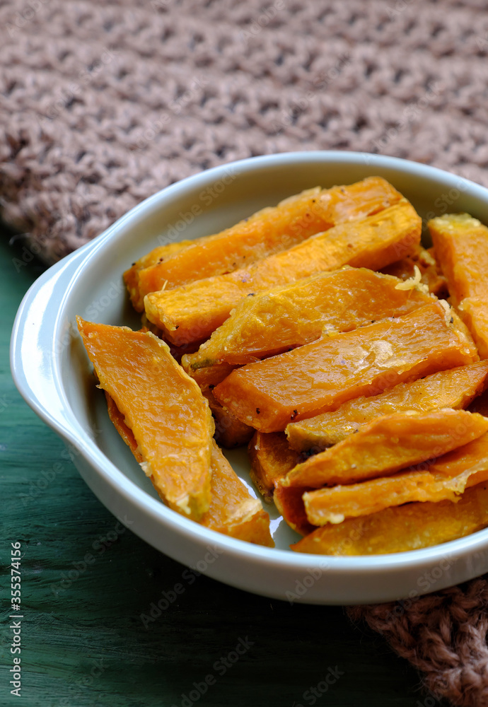 healthy food for vegetarian, sliced of baked yellow squash, nutrition for vegan meal or non meat diet healthy food for vegetarian, sliced of baked yellow squash, nutrition for vegan meal or non meat diet