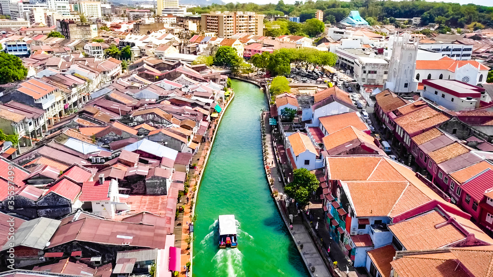 Malacca River Cruise Navigating through the UNESCO World Cultural Heritage Site, a Historical Travel and Tourism Destination in Southeast Asia.