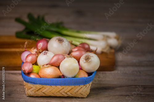 Variety of onions. In the frame  onions  shallots  white  sweet red  yellow onions  green onions.