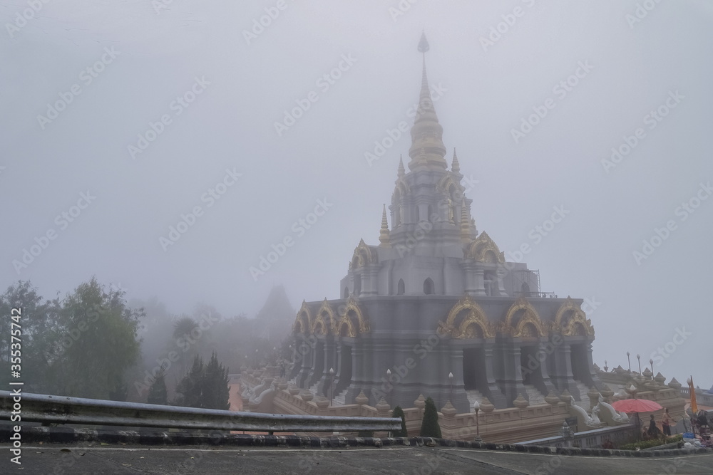 view morning of buddhist temple around with soft fog background, Wat Santi Khiri, Doi Mae Salong Nok, Chiang Rai, northern of Thailand.