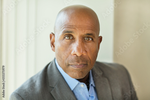 Happy mature African American man at work. photo